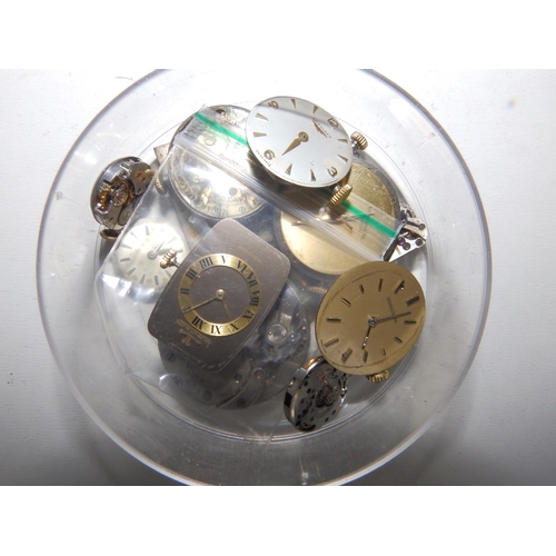 149a - A large collection of antique and vintage wrist  & pocket watch movements, dials and parts, includin... 