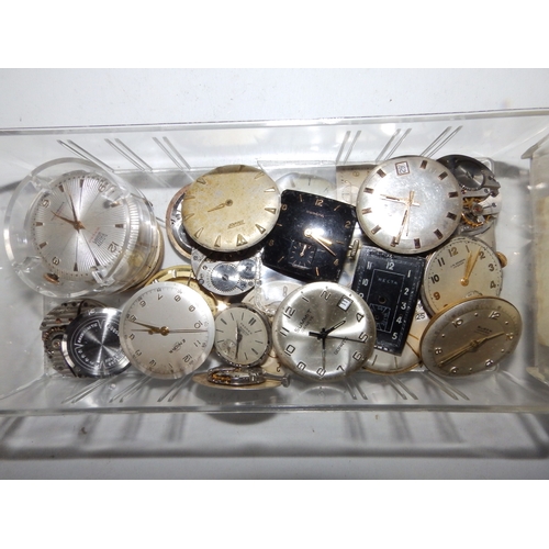 149a - A large collection of antique and vintage wrist  & pocket watch movements, dials and parts, includin... 