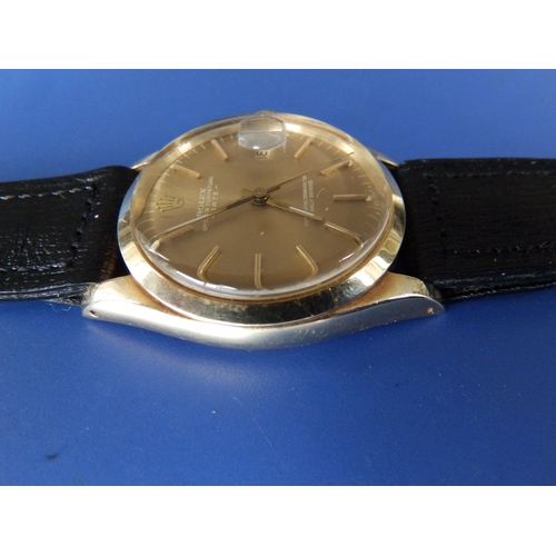 157 - A gent's 14ct gold Rolex Oyster Perpetual Date wrist watch with gold dial & baton markers, 33mm diam... 