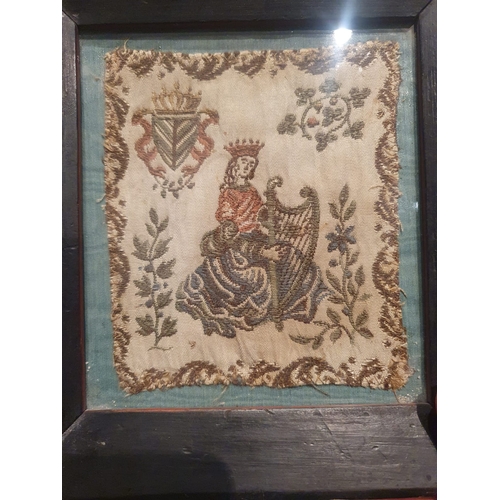 21a - An antique Irish embroidery, depicting a crowned female figure playing a harp, a crowned harp and sh... 