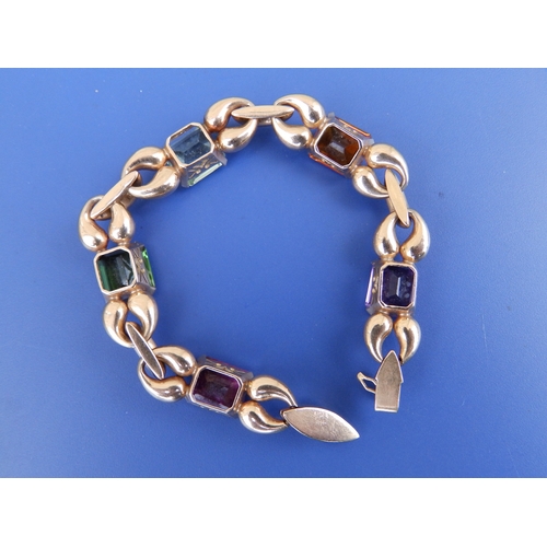 171 - A 1950's gold bracelet set with five claw-set rectangular stones of differing colours, 7