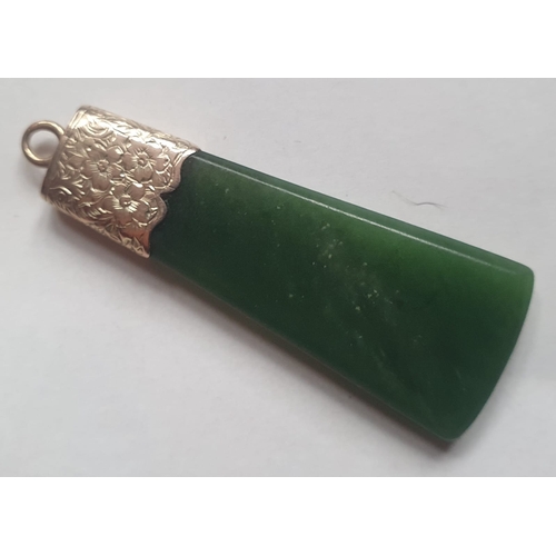 177 - An antique New Zealand pounamu jade axe-head shape pendant with yellow metal mount, 1.9