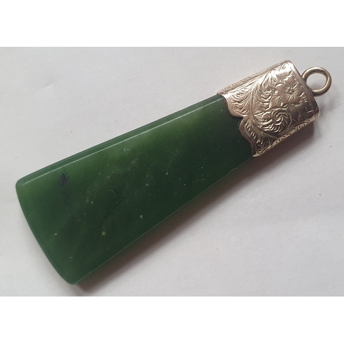 177 - An antique New Zealand pounamu jade axe-head shape pendant with yellow metal mount, 1.9