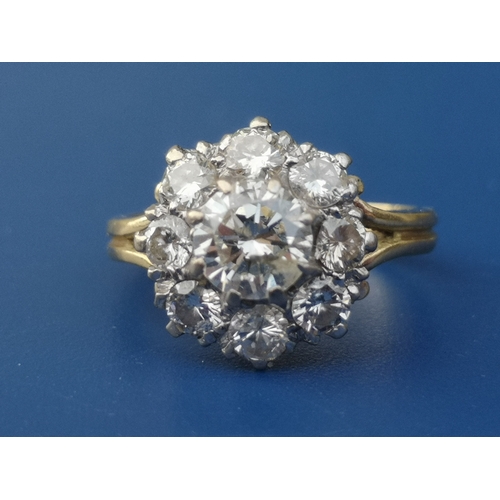 185 - A diamond claw set cluster ring on 18ct shank.  Finger size H.