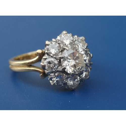 185 - A diamond claw set cluster ring on 18ct shank.  Finger size H.