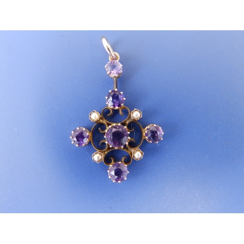 188 - An early 20thC amethyst & pearl set yellow metal pendant, 1.2