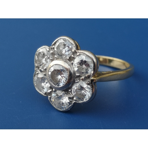 190 - A diamond 'daisy' cluster ring, the seven collet set brilliants of total weight approximately 1.8 ca... 