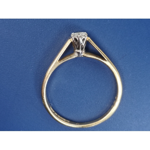 198 - A small modern diamond set 18ct gold solitaire ring.  Finger size L/M.