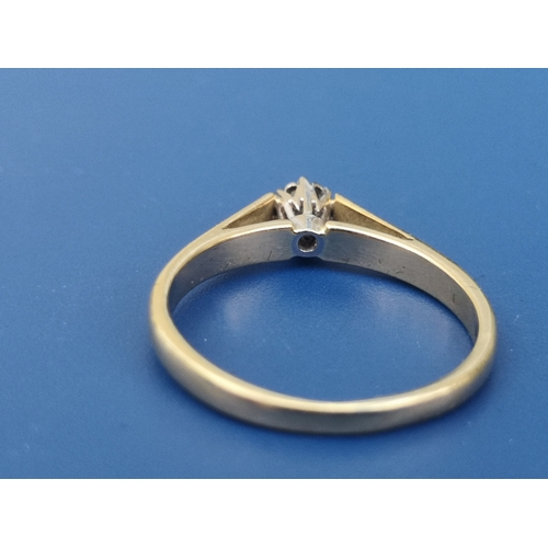 198 - A small modern diamond set 18ct gold solitaire ring.  Finger size L/M.