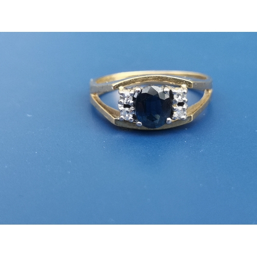 199 - A modern sapphire & diamond set 18ct gold ring.  Finger size M/N.