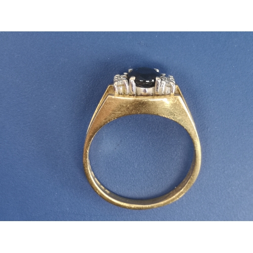 199 - A modern sapphire & diamond set 18ct gold ring.  Finger size M/N.