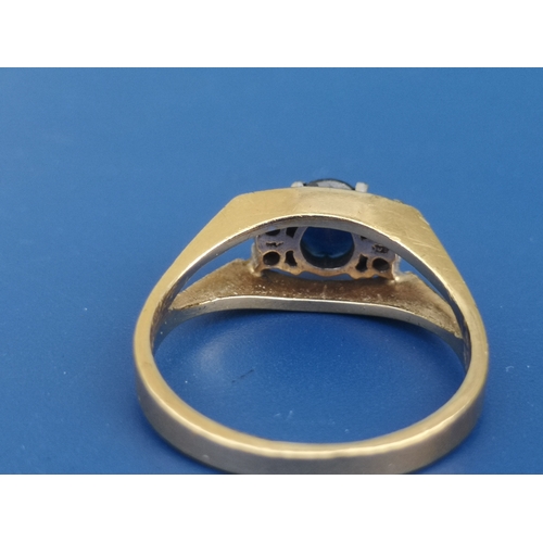 199 - A modern sapphire & diamond set 18ct gold ring.  Finger size M/N.