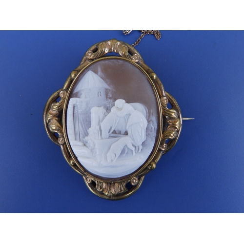 224 - A Victorian oval shell cameo brooch depicting a young woman with her horse & dog at a well, 2.5