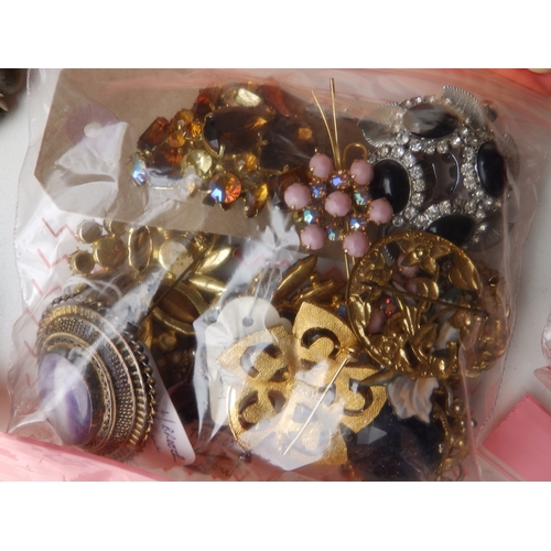 162 - A quantity of beads & costume jewellery.