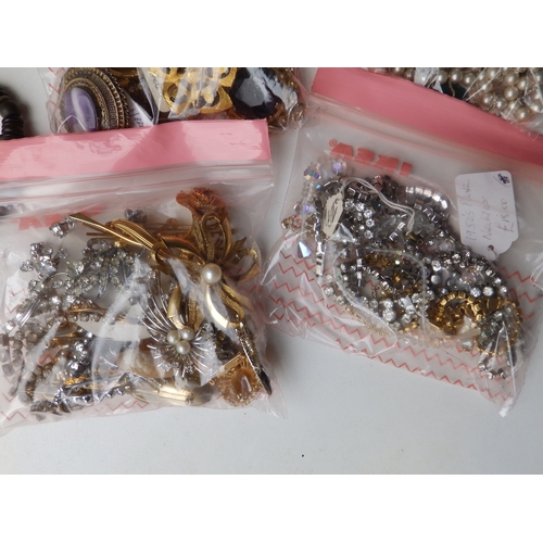 162 - A quantity of beads & costume jewellery.