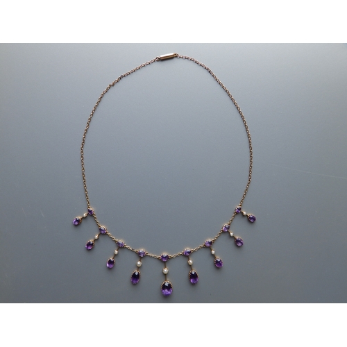 163 - A late Victorian/Edwardian amethyst & pearl set gold fringe necklace, 17.5