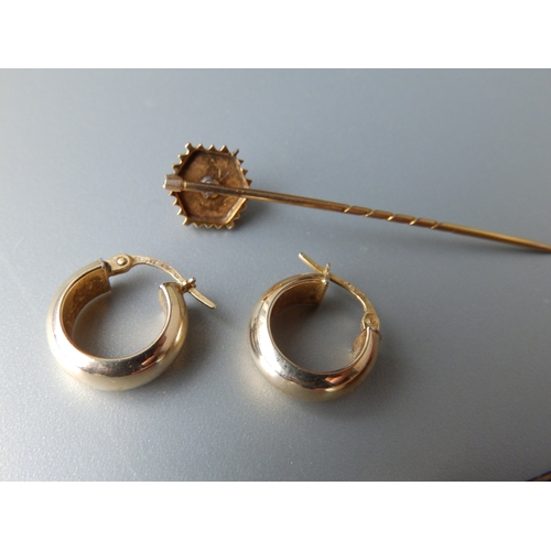 187 - A pair of gold hoop earrings, a gold pin and one other. (4)