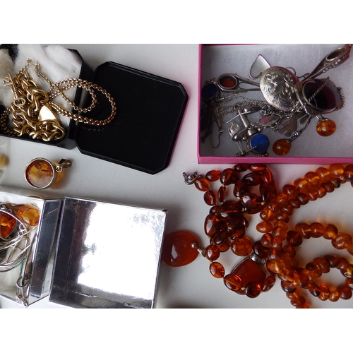 216 - A quantity of silver, amber and other costume jewellery.