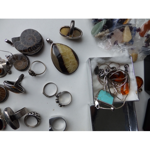 216 - A quantity of silver, amber and other costume jewellery.