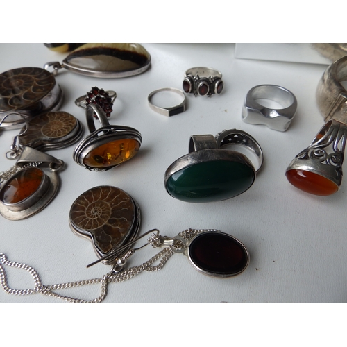 216 - A quantity of silver, amber and other costume jewellery.