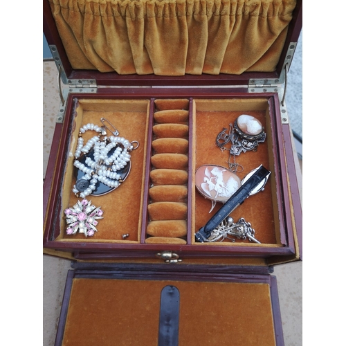 173 - A jewellery box & contents.