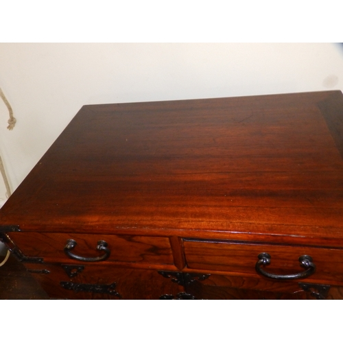 61 - An  Oriental table-top cabinet with iron mounts, 23