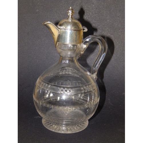 120 - A Victorian silver mounted jug, having hinged cover, glass loop handle onto rounded body with shallo... 