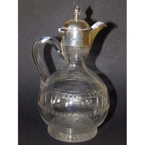 120 - A Victorian silver mounted jug, having hinged cover, glass loop handle onto rounded body with shallo... 