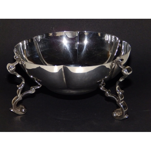 122 - A Mappin & Webb silver bowl of scalloped circular form, raised on three bold scrolling feet - London... 