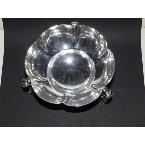 122 - A Mappin & Webb silver bowl of scalloped circular form, raised on three bold scrolling feet - London... 