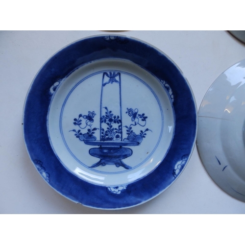 46 - A set of four antique Chinese blue & white plates, each decorated with a basket of flowering plants,... 