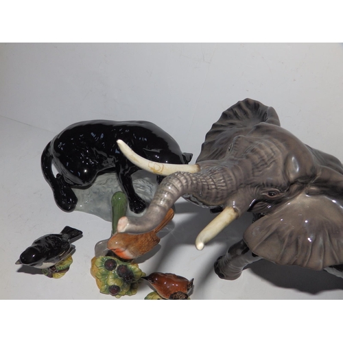 55 - A Beswick elephant with repaired tusk, 10