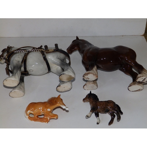 56 - A Beswick grey shire mare, a brown shire mare and two small Beswick horses. (4)