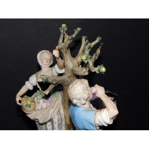 61 - A 19thC Meissen porcelain allegorical figure group after Acier depicting an applepicker with shepher... 