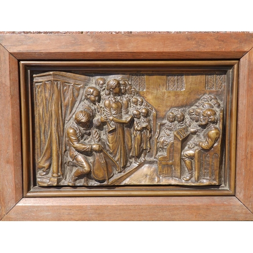 69 - A Victorian framed bronze relief plaque, modelled to depict a church interior with a choir accompani... 