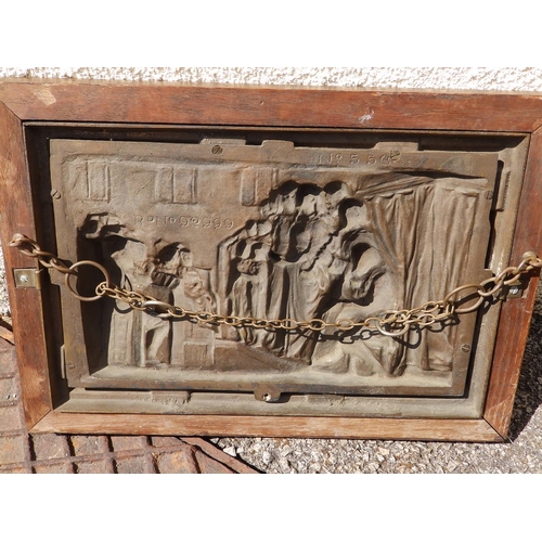 69 - A Victorian framed bronze relief plaque, modelled to depict a church interior with a choir accompani... 