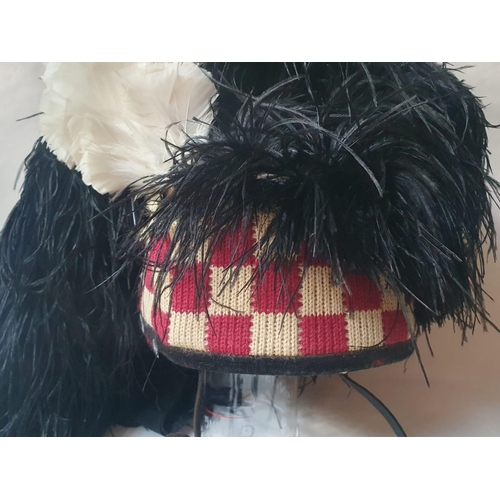 72 - A Scottish military feather bonnet with four tails.