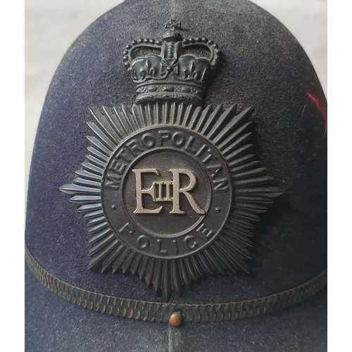 74 - A vintage Metropolitan Police helmet.