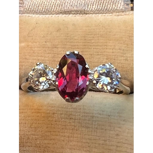 220 - A certified natural ruby & diamond three stone ring, the claw set cushion cut ruby weighing approxim... 