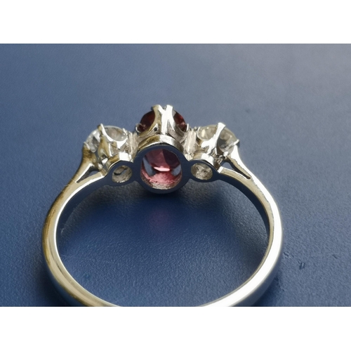 220 - A certified natural ruby & diamond three stone ring, the claw set cushion cut ruby weighing approxim... 