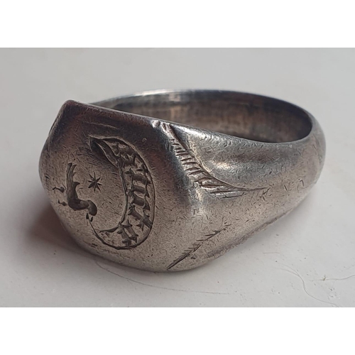 225 - A large 15thC silver seal ring, the engraved bezel depicting a bird inscribed 'Uture', presumably ov... 