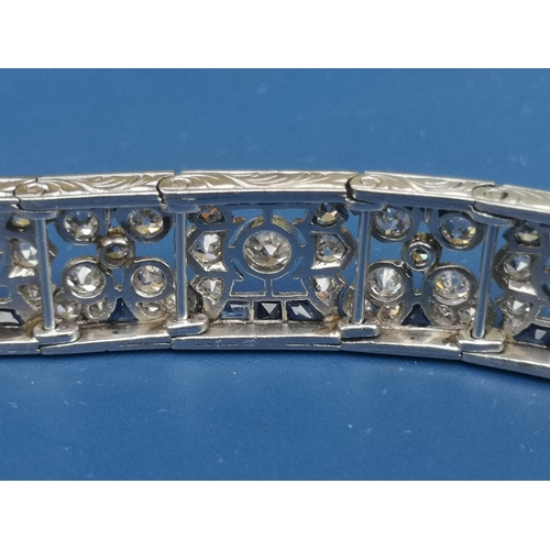 230 - An Edwardian sapphire & diamond set panel bracelet,  of openwork form, having numerous millegrain se... 