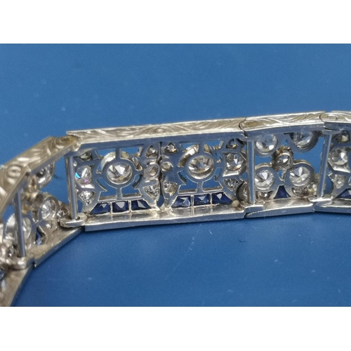 230 - An Edwardian sapphire & diamond set panel bracelet,  of openwork form, having numerous millegrain se... 