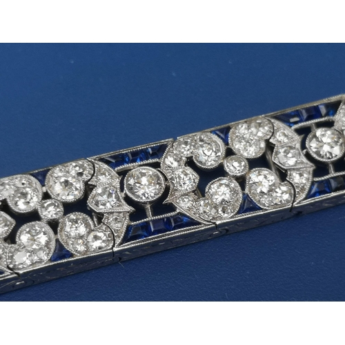 230 - An Edwardian sapphire & diamond set panel bracelet,  of openwork form, having numerous millegrain se... 