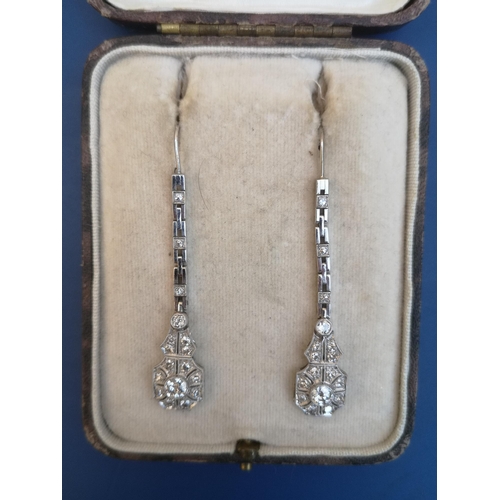 206 - A boxed pair of art deco diamond millegrain set drop earrings, the two principal stones in each bein... 