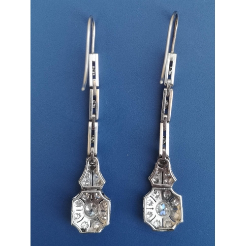 206 - A boxed pair of art deco diamond millegrain set drop earrings, the two principal stones in each bein... 