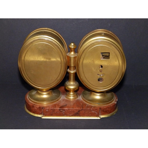 102 - A twin dial brass clock/barometer on red marble base, 6.25