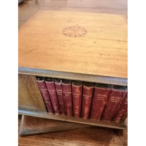 120 - A small Edwardian inlaid mahogany revolving square bookcase, together with 39 books including sets o... 