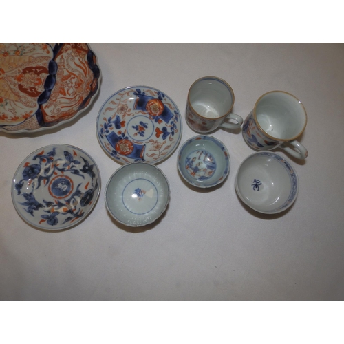 42 - Three 18th/19thC Oriental Imari coloured tea bowls, two cups, two saucers and a Japanese Imari 8.6