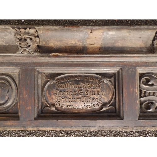 88 - An Edwardian carved oak frieze, the (incomplete) cornice applied with a series of male masks resembl... 